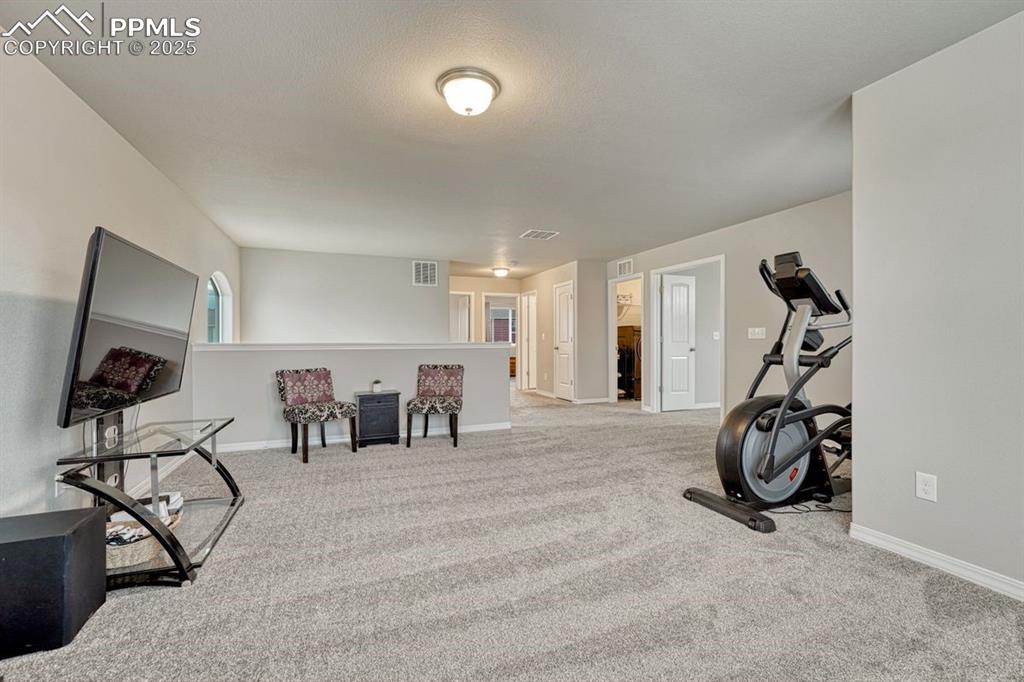 Image 20 of 40: This is the perfect space to use how you choose! Whether a home gym, media 
