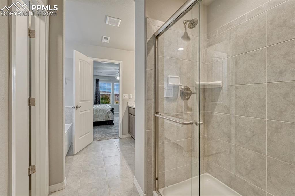 Image 23 of 40: Primary 5 piece en-suite with glass walled shower