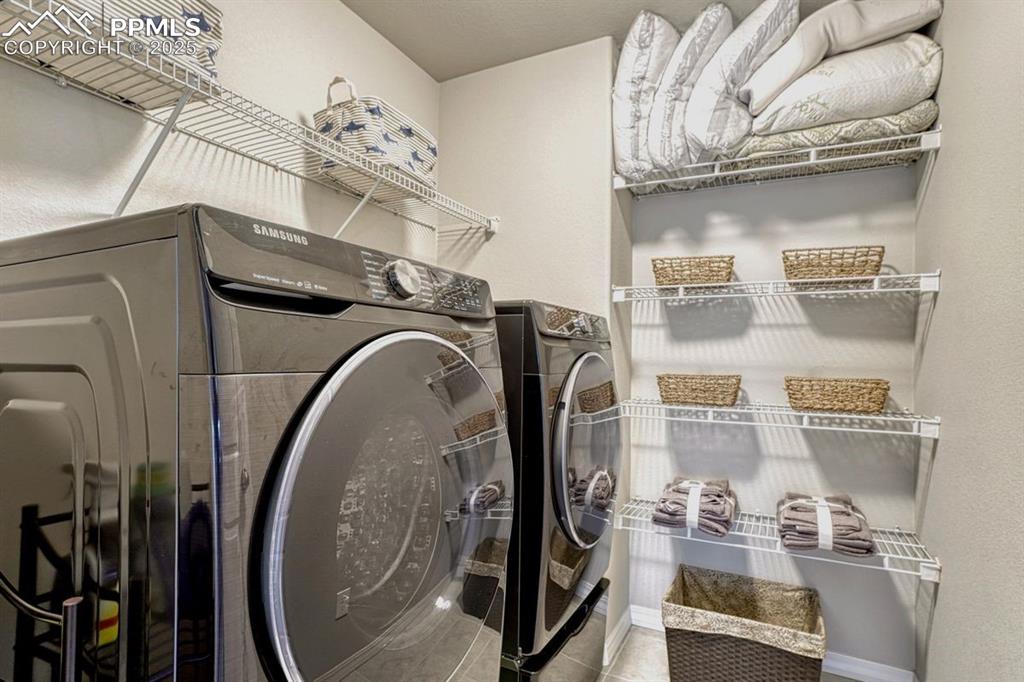 Image 25 of 40: Upstairs laundry is convenient to the bedrooms. Just where you need it the 