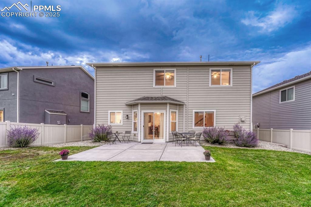 Image 30 of 40: Fenced back yard has plenty of room to create your dream garden or to enjoy