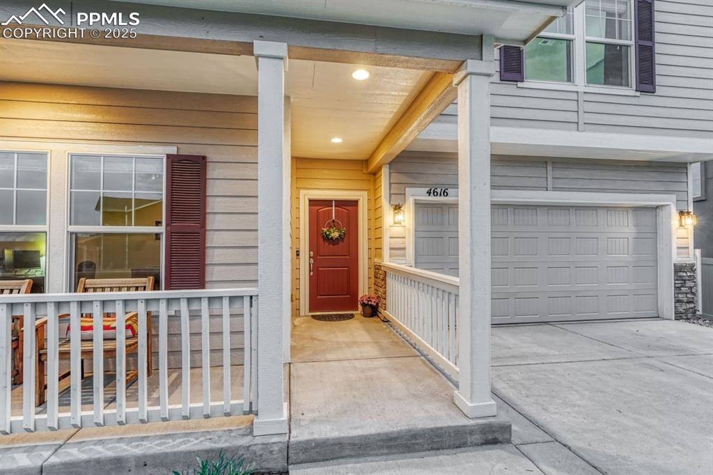 Image 6 of 40: A covered front porch and approach to the door - not just practical, but a 