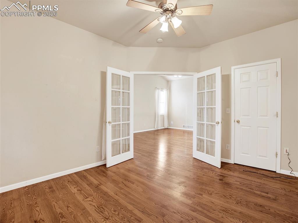 Image 15 of 49: French door entry into Bedroom #3