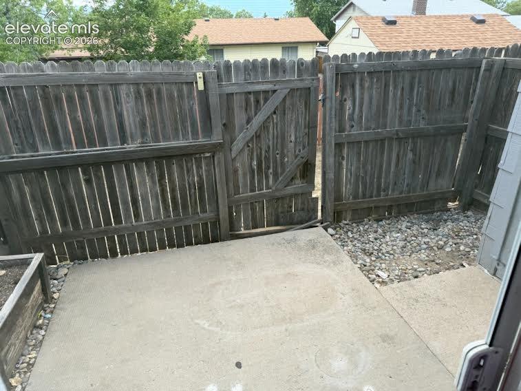 Image 14 of 17: HOA is scheduled to replace the back fence and gate.