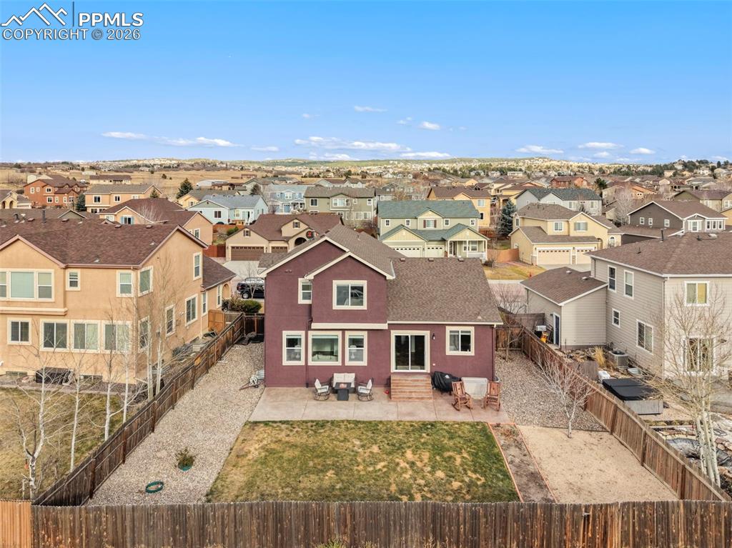 Image 29 of 31: Back of property featuring a patio area, entry steps, a residential view, a