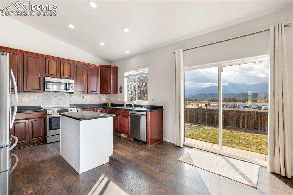 Image 3 of 31: Eat in kitchen with mountain views