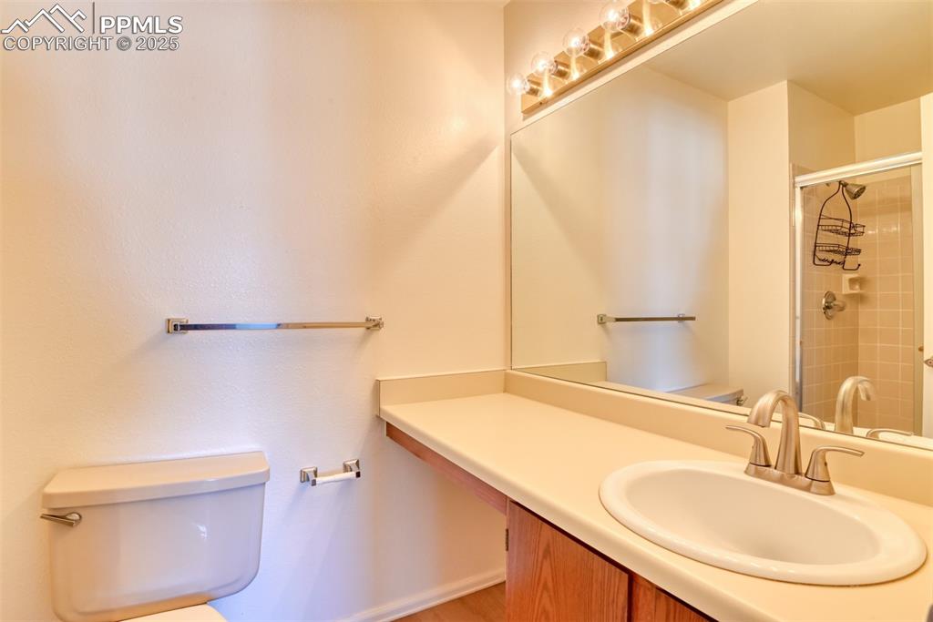 Image 28 of 42: Bathroom featuring vanity and a shower stall