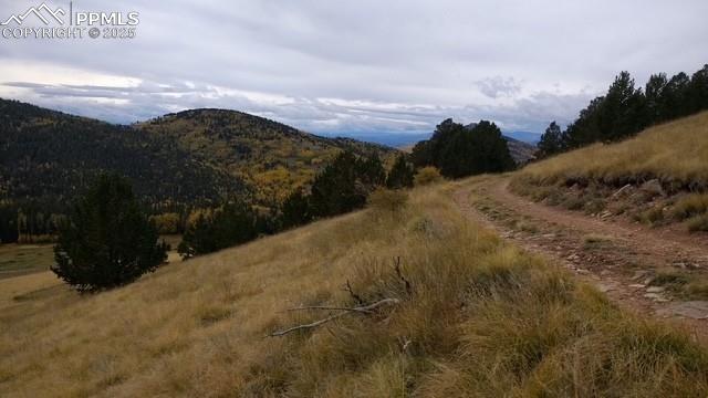 Image 6 of 15: View of mountain background featuring rural landscape