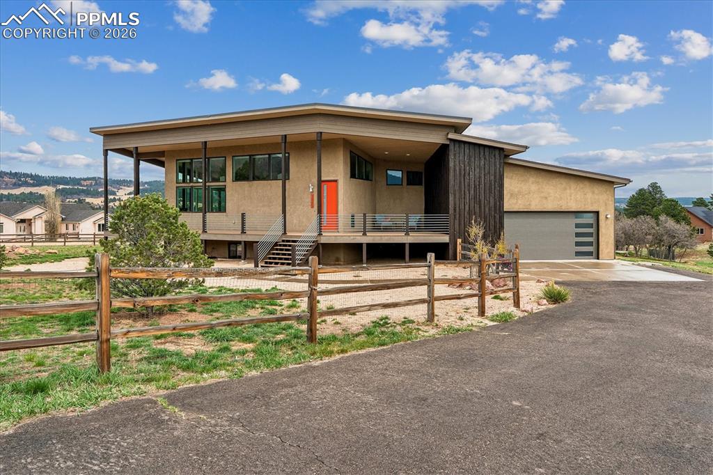 Image 2 of 50: Cloven Hoof Estates home in Monument on .77 acres with paved driveway up to