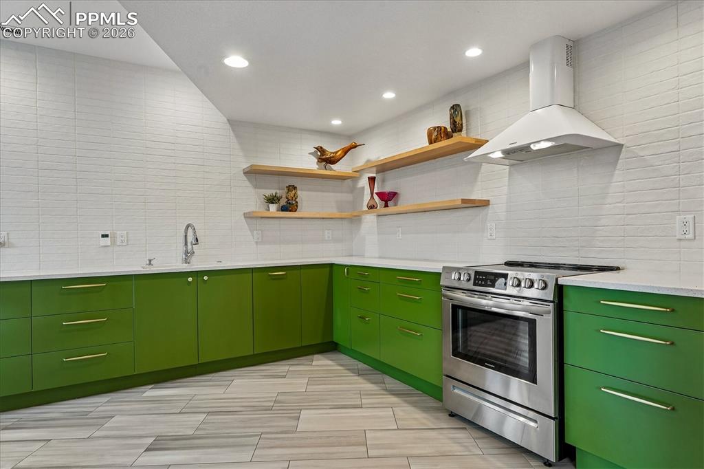 Image 41 of 50: Basement kitchen with heated tile flooring, custom soft-close European-styl
