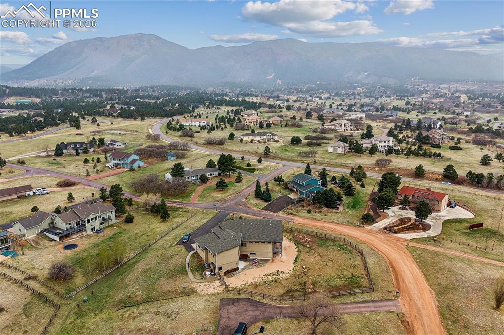 Image 46 of 50: Cloven Hoof Estates Aerial view of the lot with paved driveway leading up t