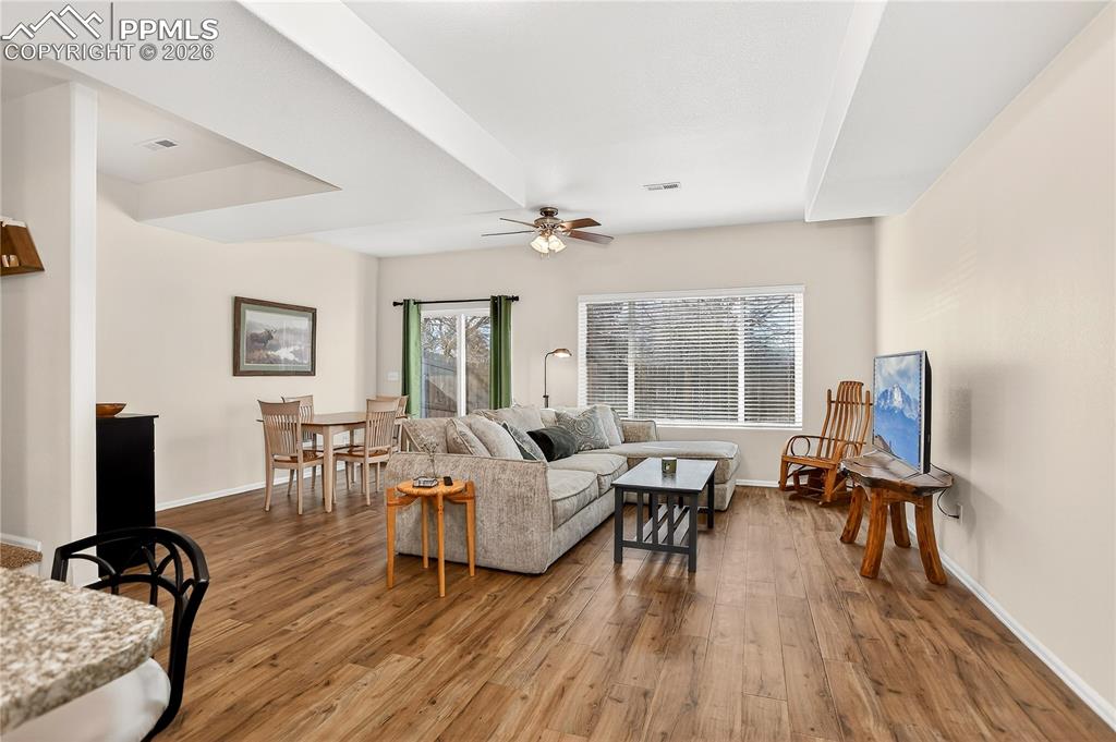 Image 3 of 32: View of living room from kitchen.