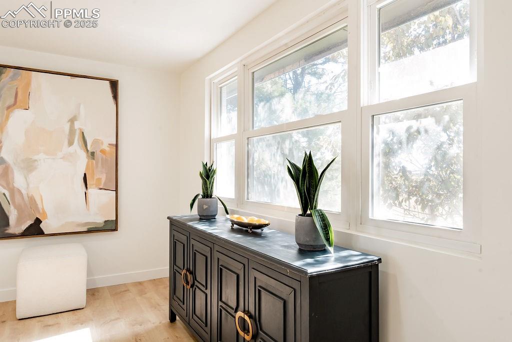 Image 16 of 43: Home office with light wood-style floors and baseboards