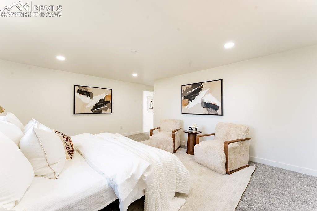 Image 25 of 43: Bedroom with carpet flooring and recessed lighting