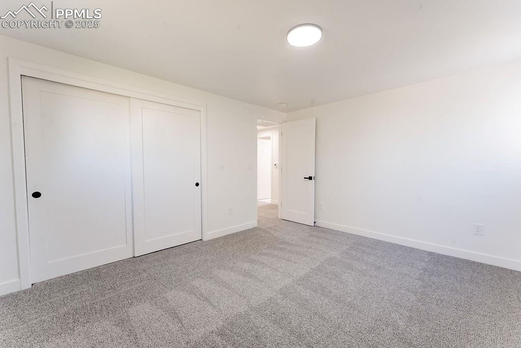 Image 30 of 43: Unfurnished bedroom featuring carpet and a closet