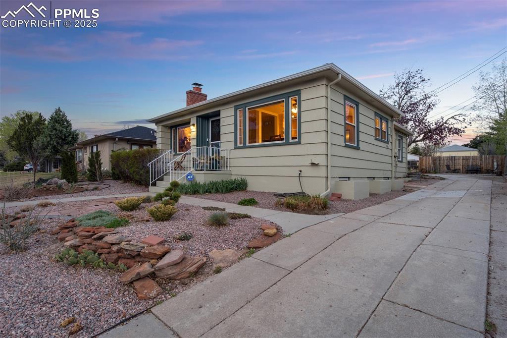 Image 4 of 50: Single story home featuring crawl space, a chimney, and fence