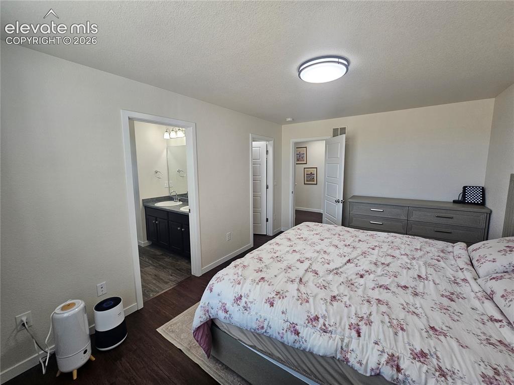 Image 14 of 23: Recessed lighting, wood-finish flooring, and a flat-panel ceiling light fix