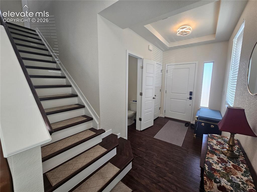 Image 3 of 23: Foyer featuring wood-finish flooring, a contemporary ceiling light fixture,