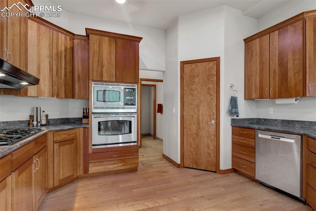 Image 12 of 47: Gourmet Kitchen featuring custom Cherry Cabinets and high end appliances an
