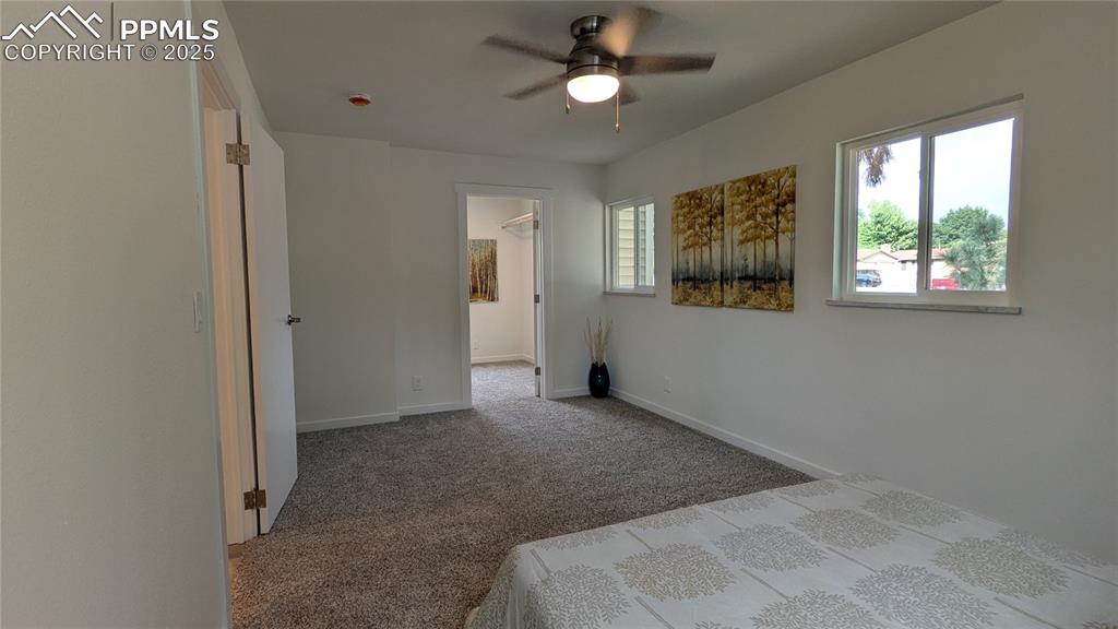 Image 15 of 39: Unfurnished bedroom with carpet floors, a ceiling fan, and a spacious close