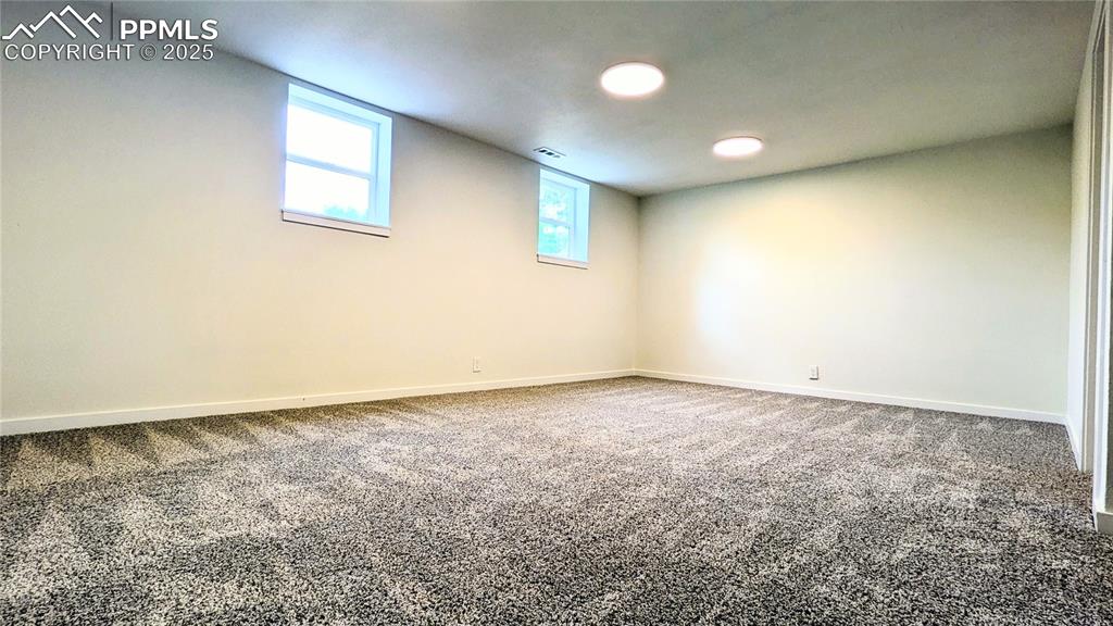 Image 21 of 39: Below grade area with carpet flooring and baseboards