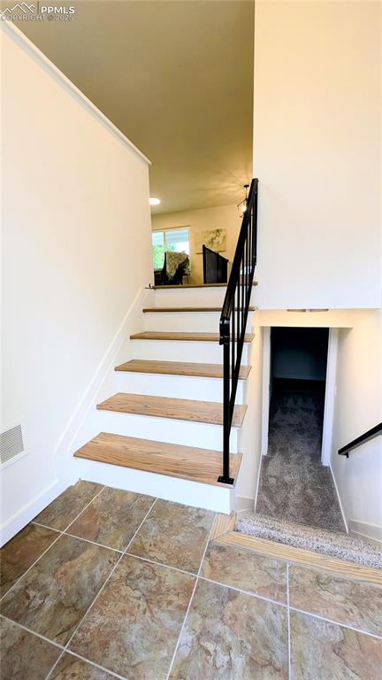 Image 33 of 39: Stairway with baseboards