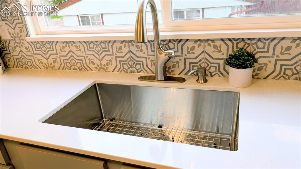 Image 35 of 39: Kitchen view of a sink