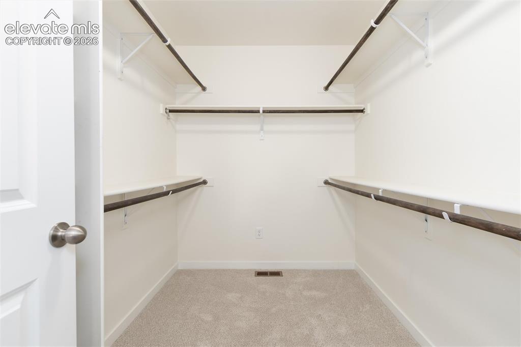 Image 29 of 43: large walk-in closet in the primary bedroom