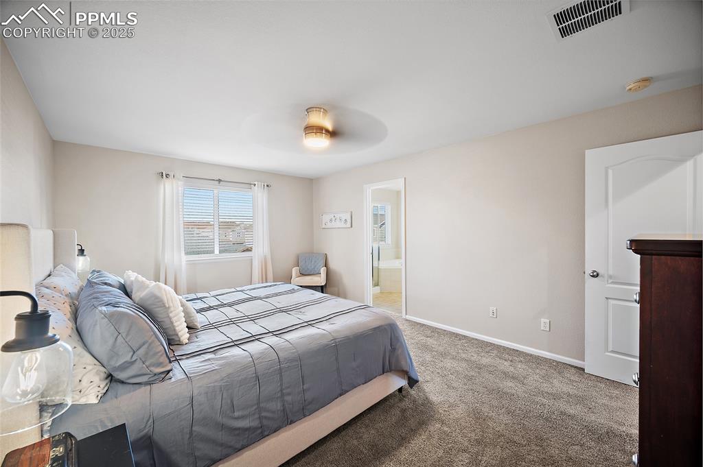 Image 27 of 50: Master Bedroom