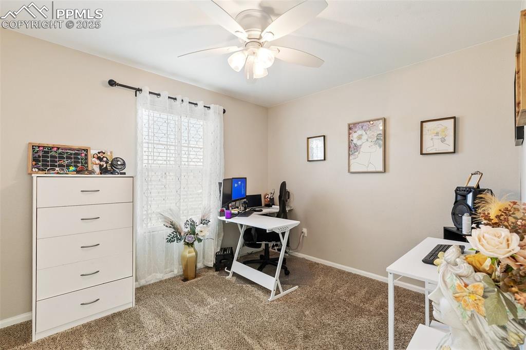 Image 18 of 27: Home office featuring carpet flooring and ceiling fan