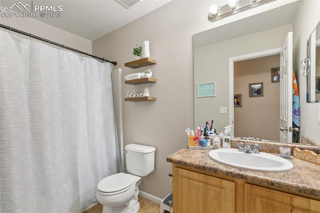 Image 19 of 27: Full bathroom featuring vanity and curtained shower