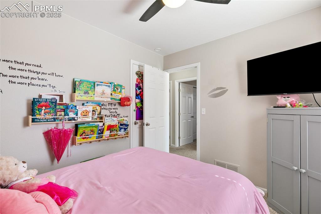 Image 20 of 27: Bedroom featuring ceiling fan