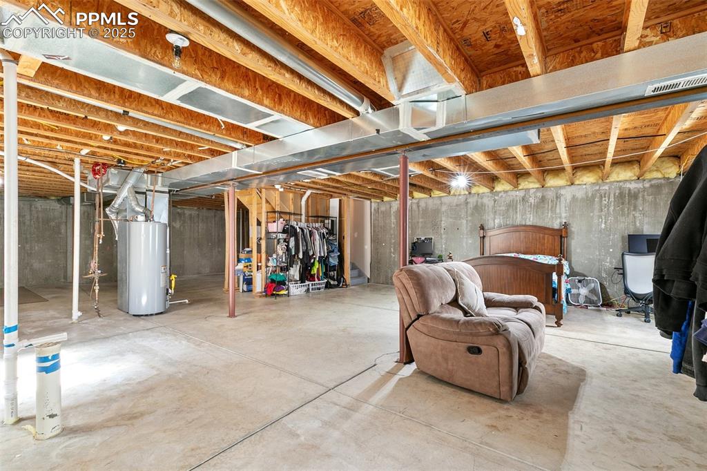 Image 24 of 27: Basement with water heater
