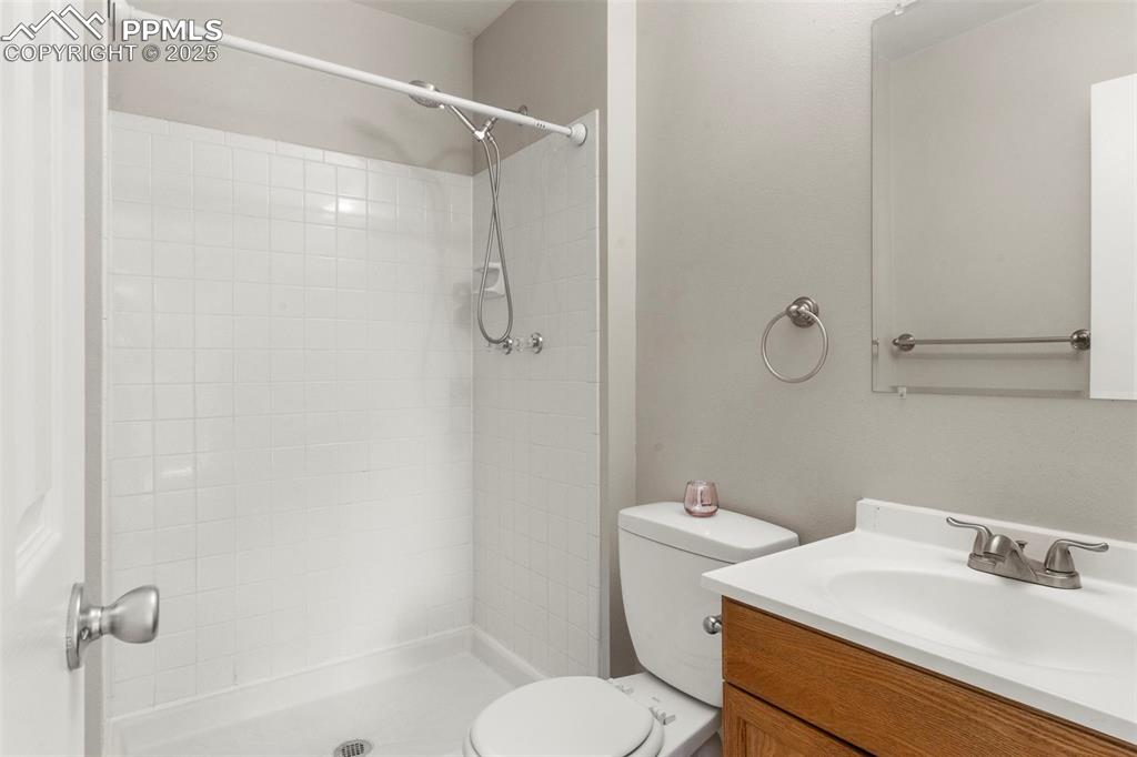 Image 15 of 24: Full bath featuring vanity and tiled shower