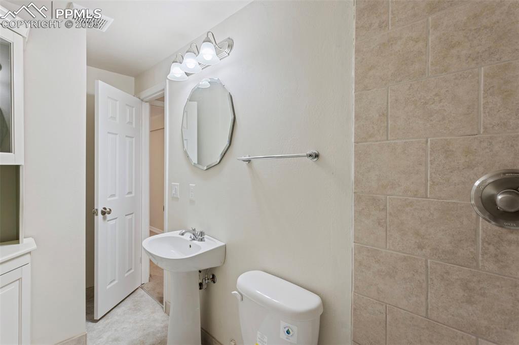 Image 13 of 37: Full bathroom featuring toilet