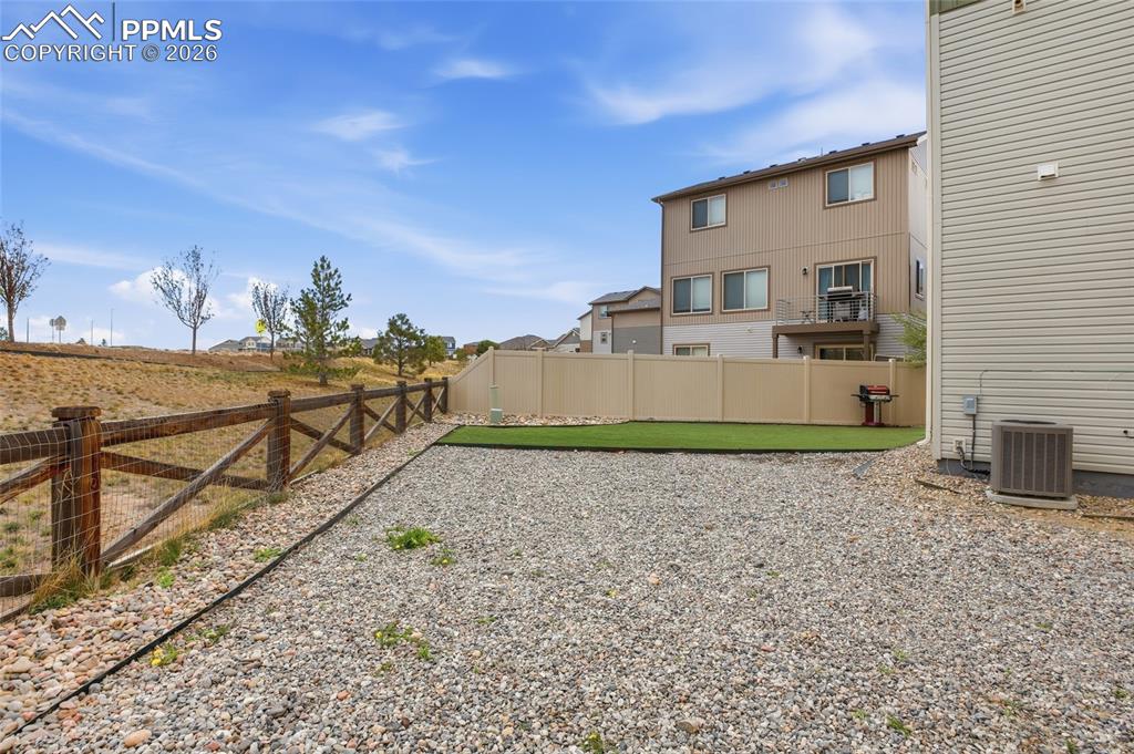 Image 26 of 29: View of fenced backyard