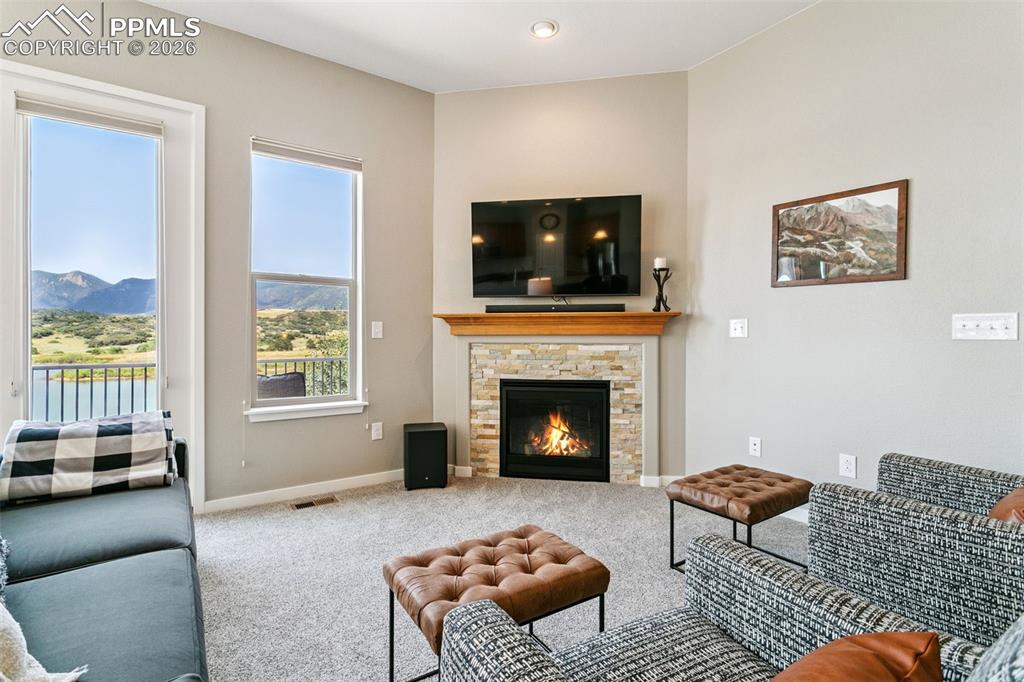 Image 11 of 50: Living Room featuring Upgraded Carpet & Pad