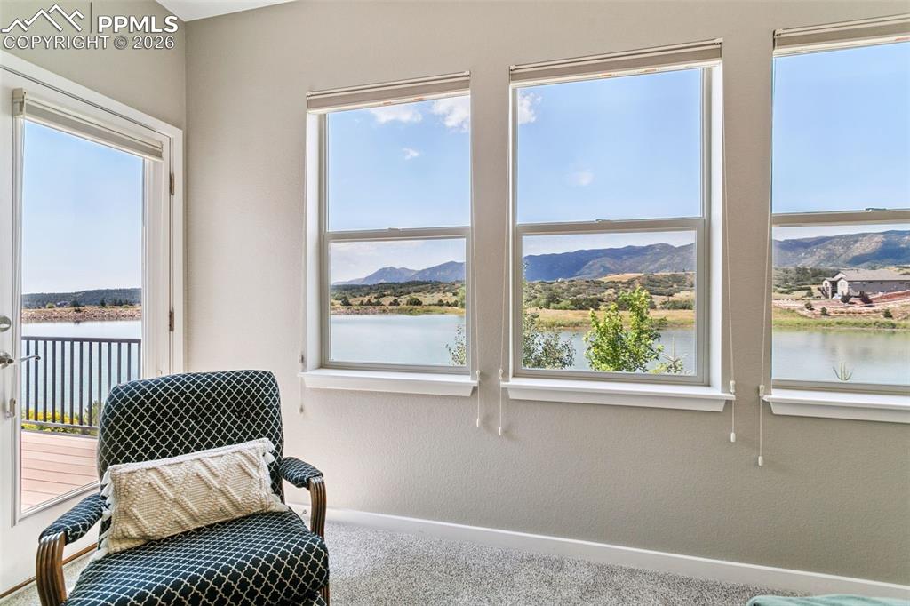Image 22 of 50: Sitting Area with a Door to the Deck