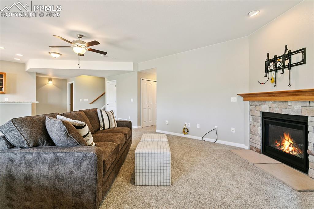 Image 34 of 50: Family Room Featuring a Stone Fireplace