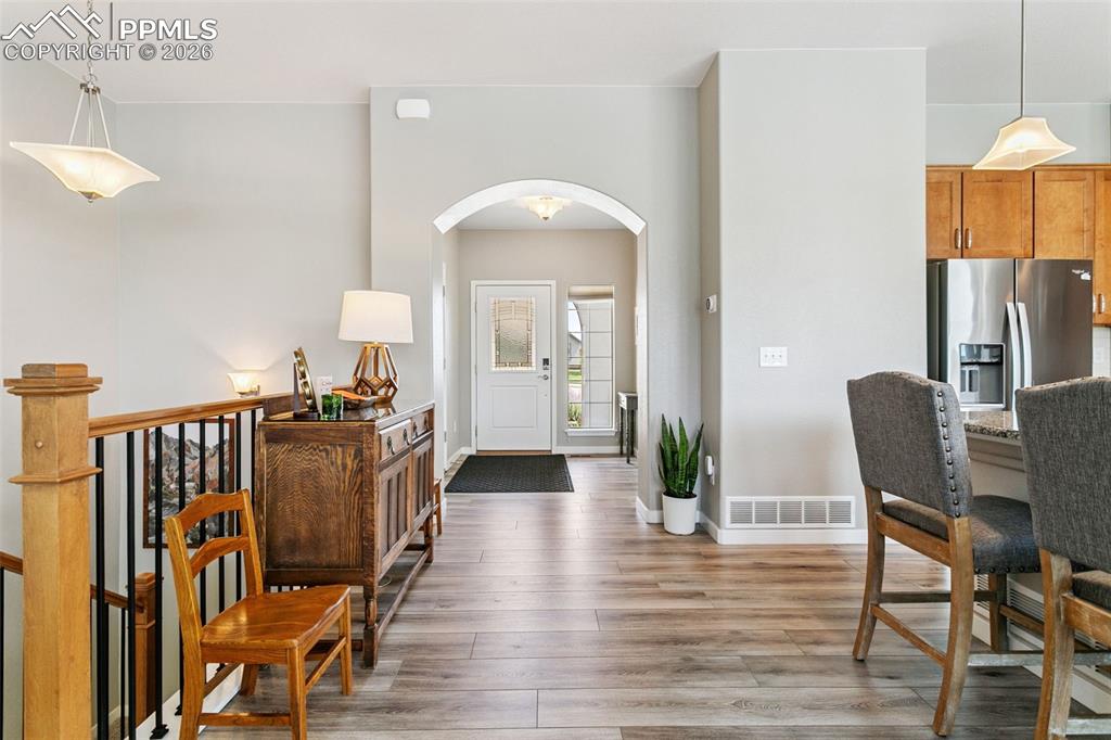 Image 7 of 50: Grand Entryway with Arched Entrance