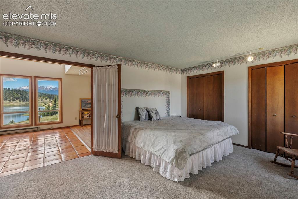 Image 12 of 26: The main level Primary is nice and spacious and en suite.