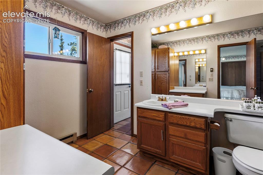 Image 13 of 26: The Primary bathroom offers plenty of natural light!