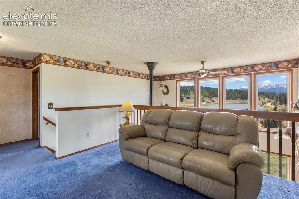 Image 14 of 26: The upstairs gives you a great loft/family room/home office area...with fab