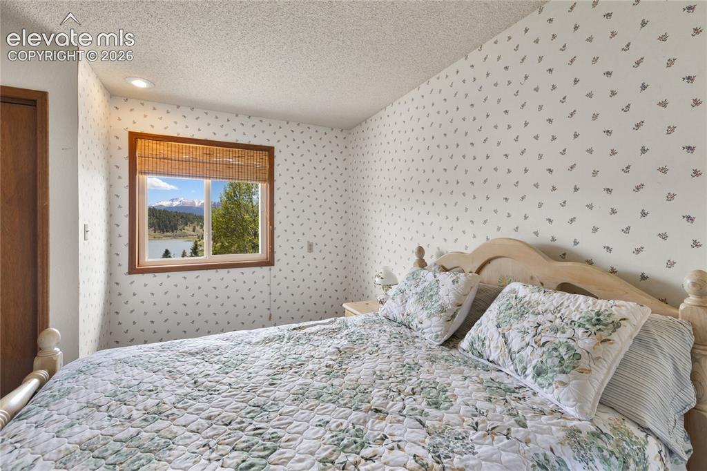 Image 15 of 26: And the views keep coming with each upper level bedroom. Bedroom one of th