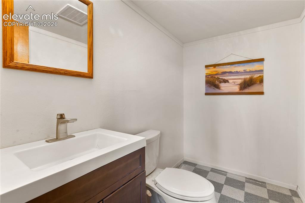 Image 21 of 26: Lower level bathroom with plenty of room to add a shower!