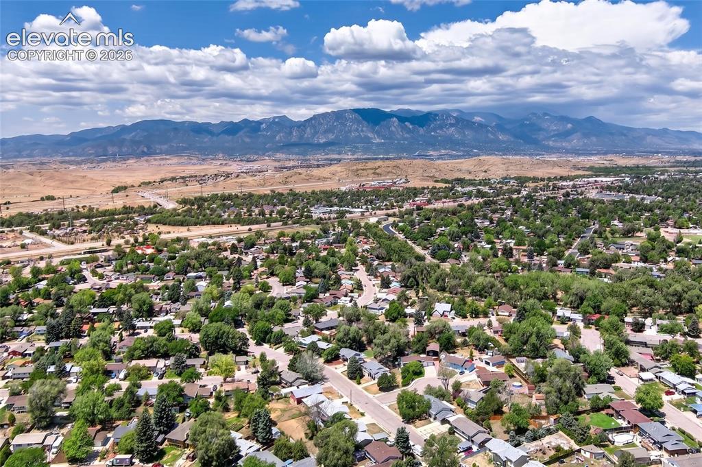 Image 21 of 21: Expansive residential area featuring established homes, mature trees, paved