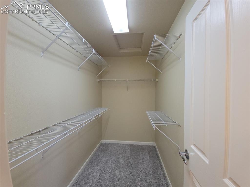 Image 12 of 19: Walk-in Closet
