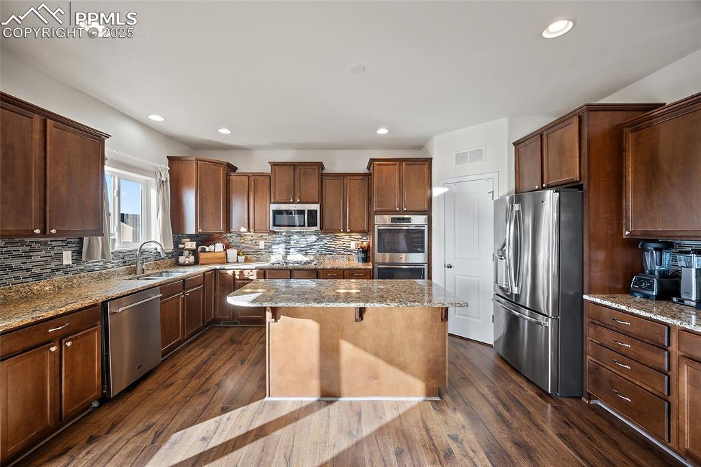 Image 10 of 50: Large corner pantry.