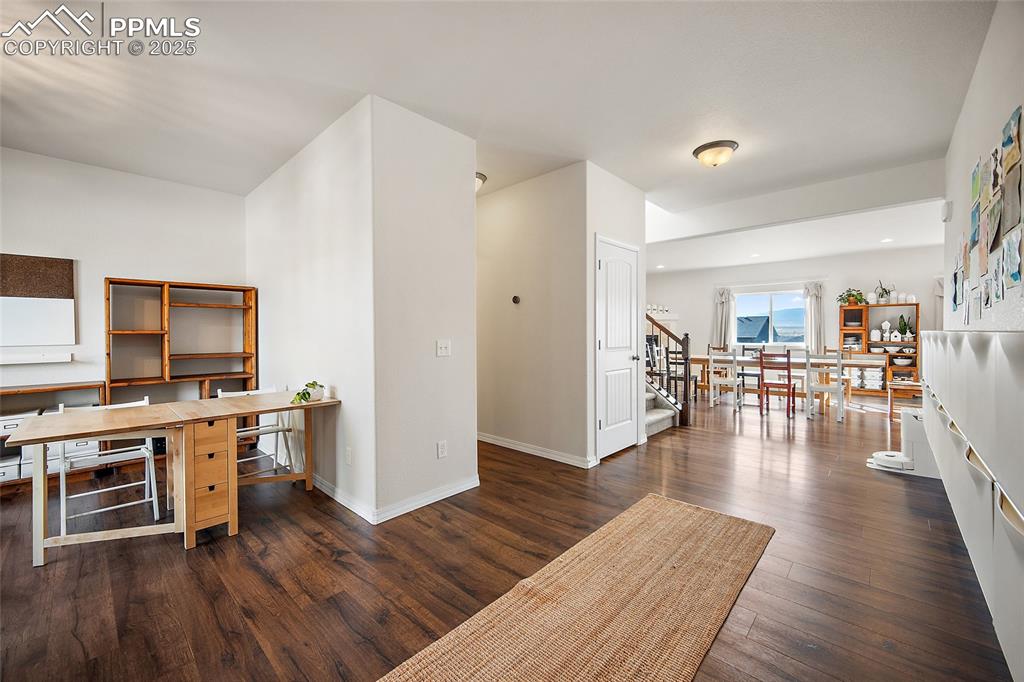 Image 14 of 50: Open office space or you can install glass French doors.