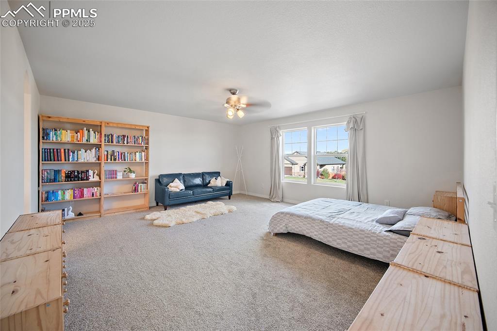 Image 24 of 50: Large primary Upper-Level Bedroom walk in closet.