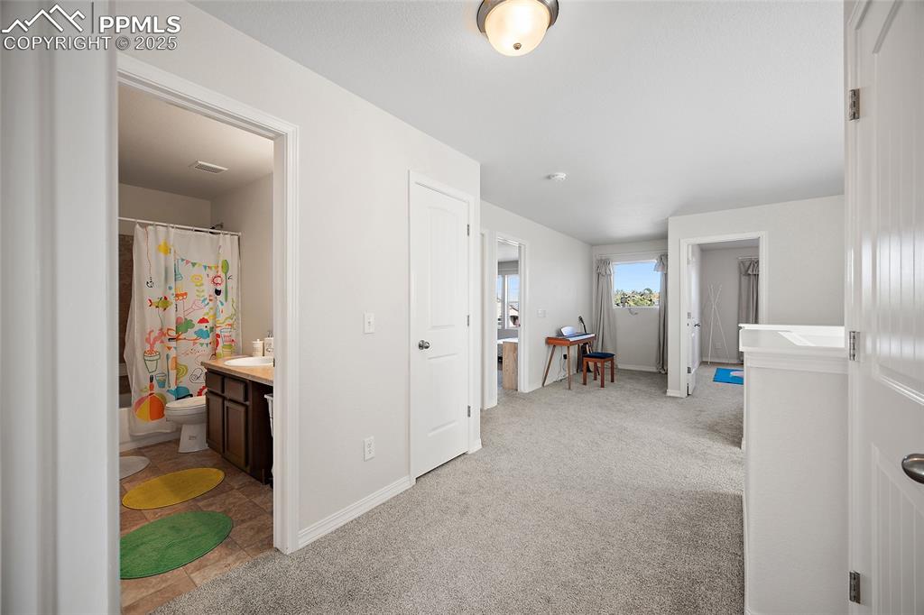 Image 34 of 50: Upper-level hallway.